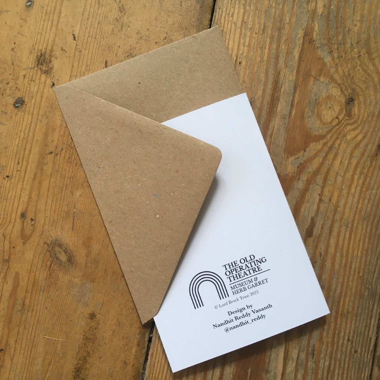 Back of a greeting card tucked into a brown envelope