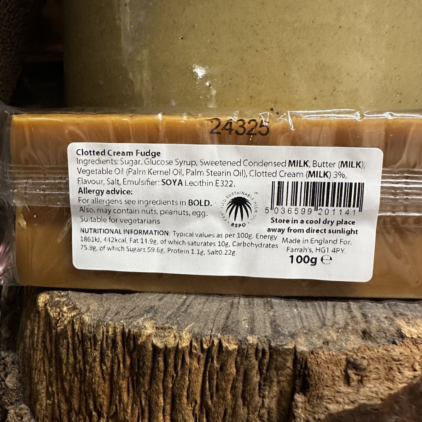 Clotted Cream Fudge bar with a label on a wooden surface