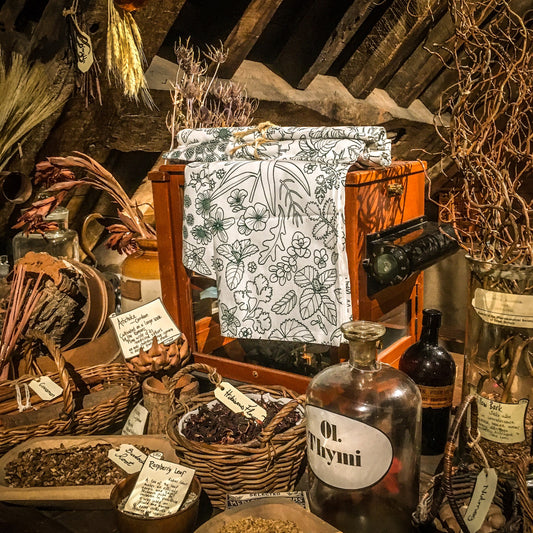 The green and white tea towel displayed in the museum's herb garret