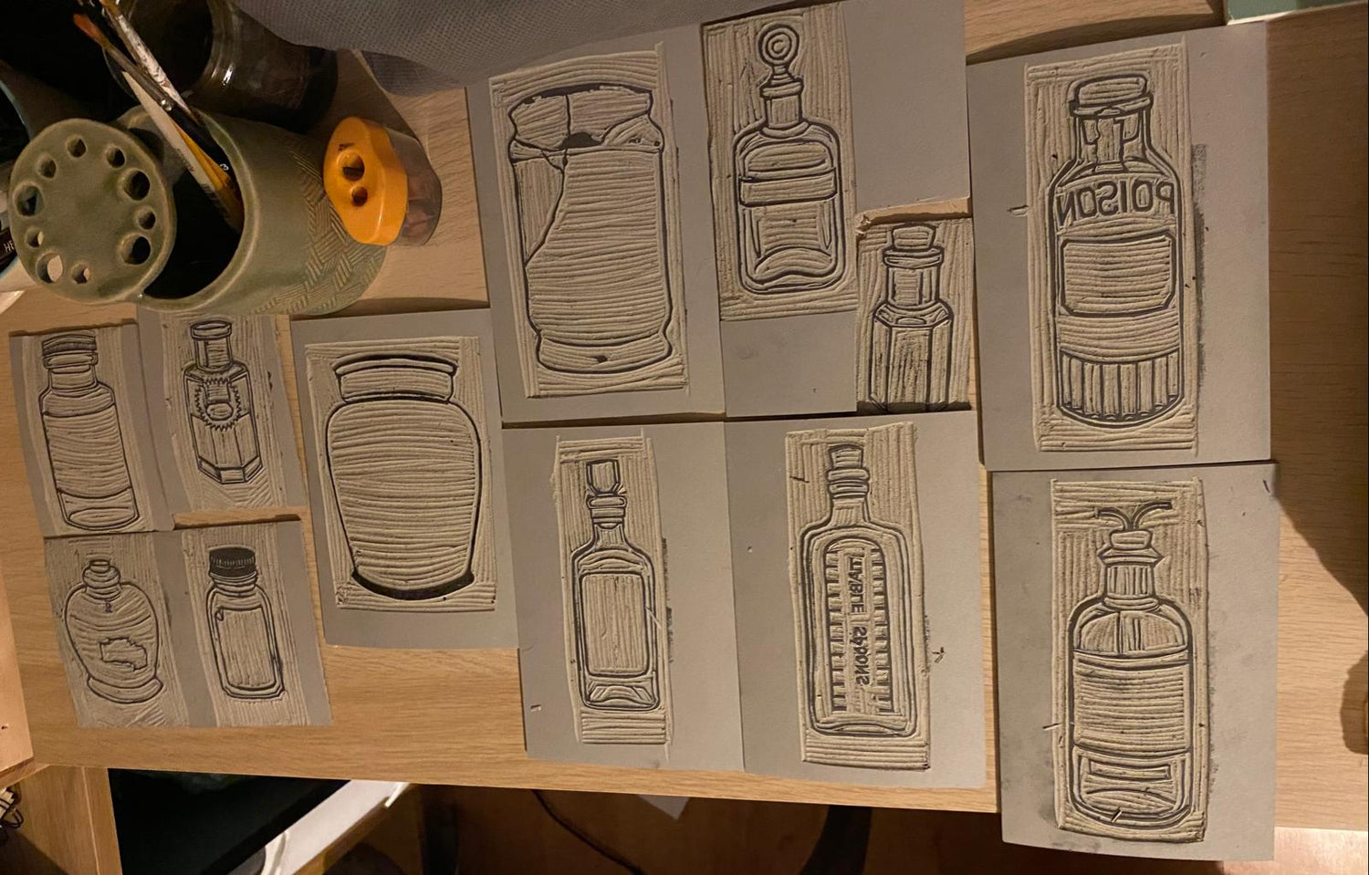 A selection of the carved plates for the bottles and jars