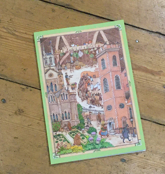 A5 notebook on wood background with illustration of Old Operating Theatre Museum on the cover.