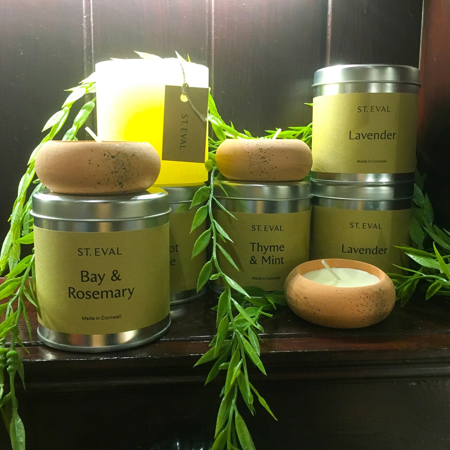 Three terracotta tealights, with candles tins of Bay & Rosemary, Thyme & Mint, and Lavender