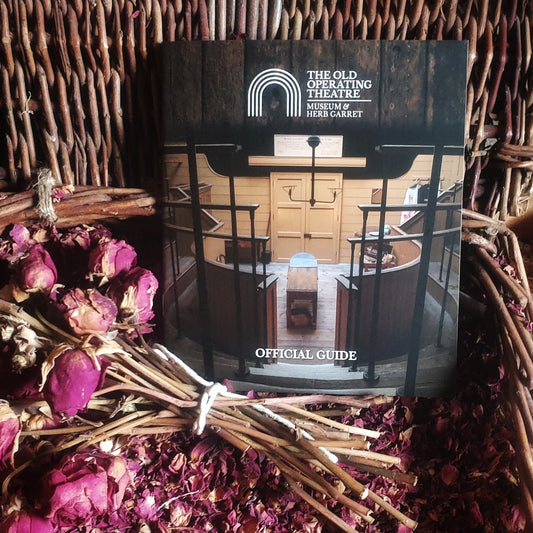 The guidebook displayed in a basket of dried rose petals