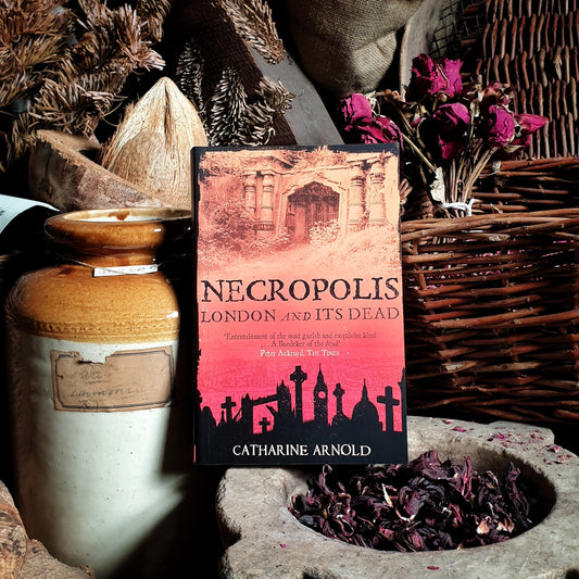 Still life with Catharine Arnold's Necropolis in museum display.