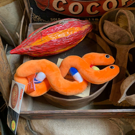 Orange DNA plush placed in the museum display
