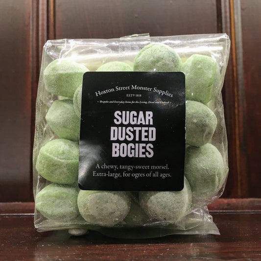 Transparent bag containing green bonbons