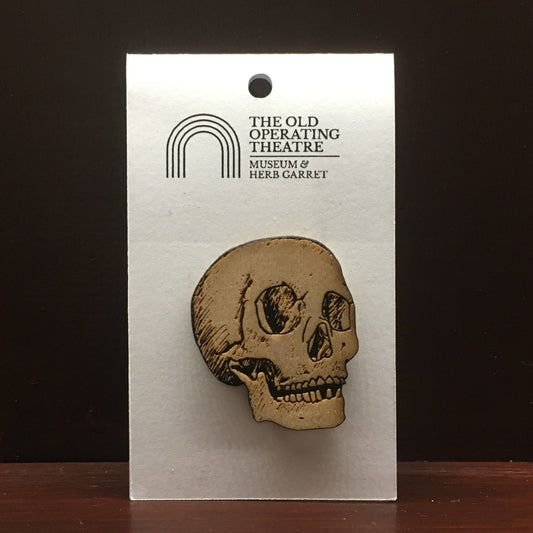 Wooden brooch in the shape of a skull