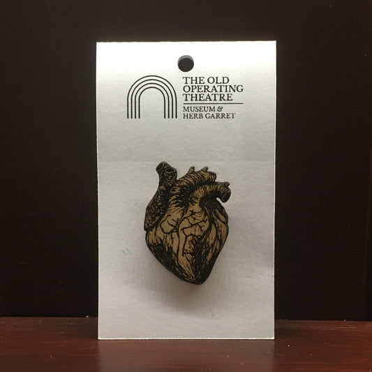 Wooden brooch in the shape of an anatomical heart