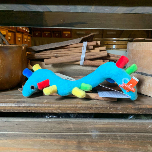 Blue plush RNA on a shelf in the museum