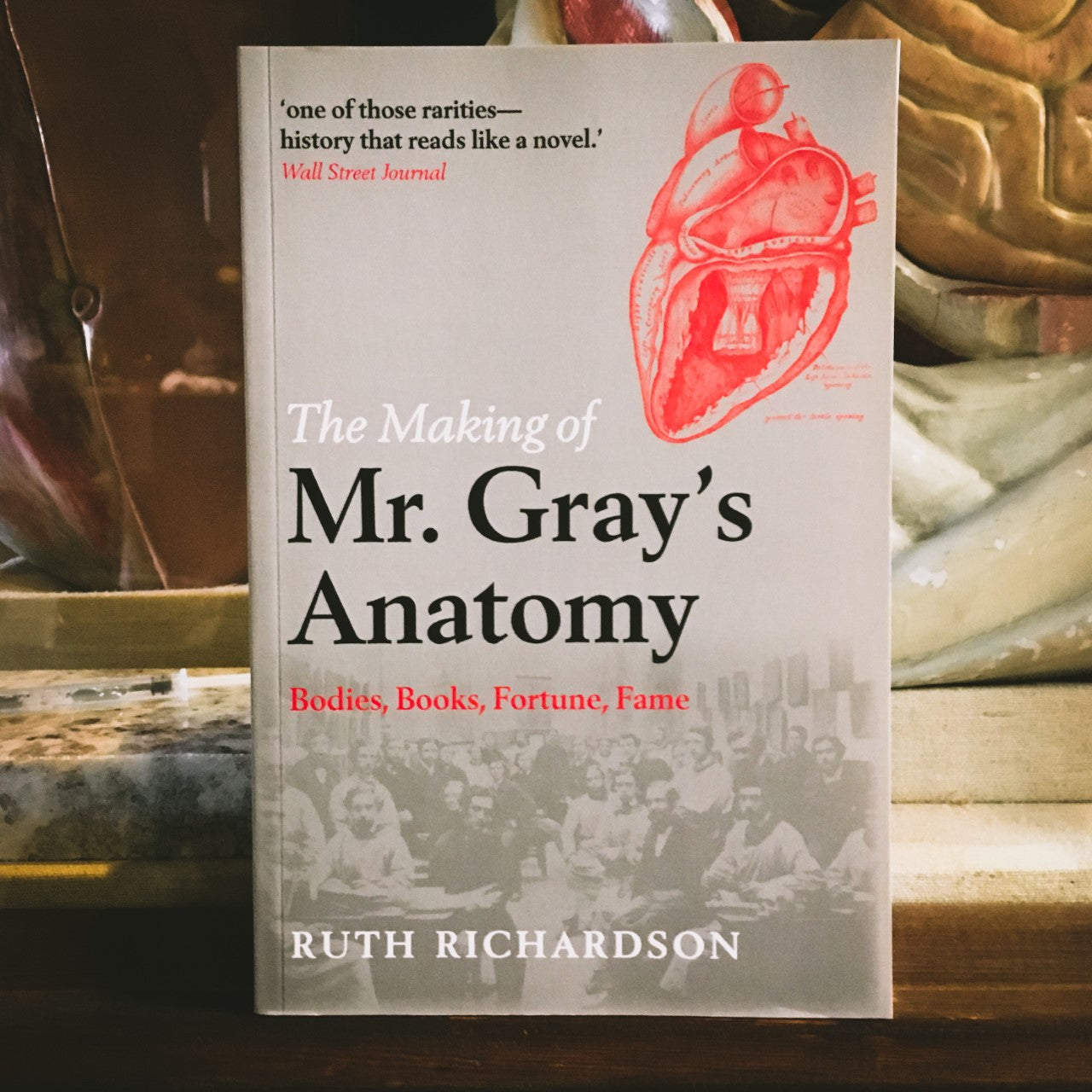 The Mr Gray's Anatomy book displayed in the museum with an anatomical model behind