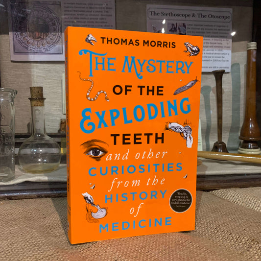 The book The Mystery of the Exploding Teeth displayed within the museum
