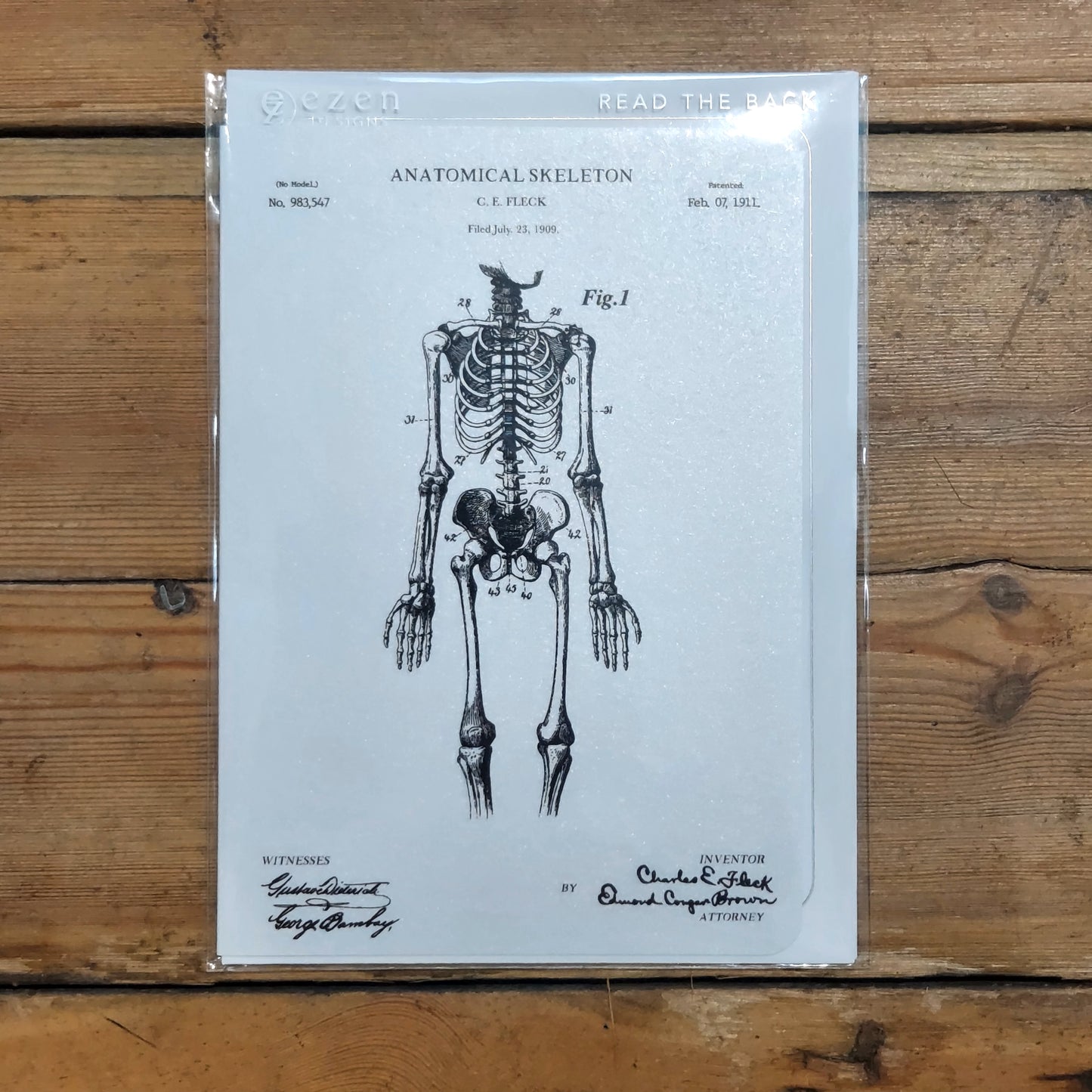 A white greetings card with an annotated illustration of a skeleton