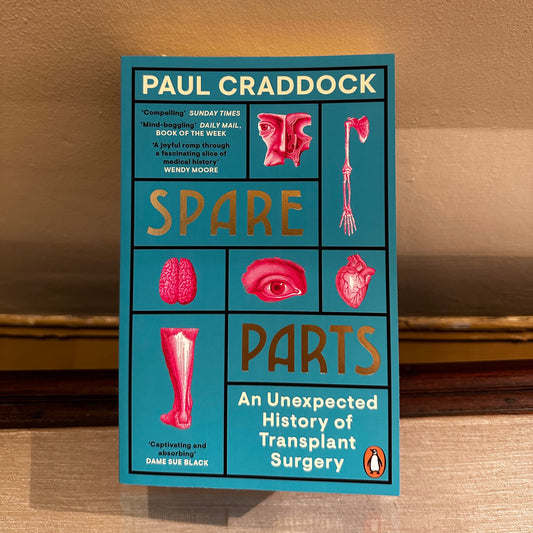 Book titled 'Spare Parts' by Paul Craddock on a wooden surface