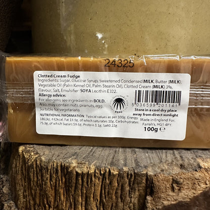 Clotted Cream Fudge bar with a label on a wooden surface