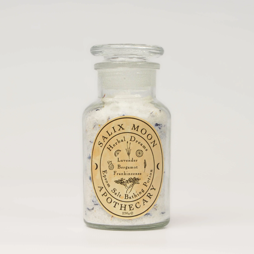 Glass jar with Salix Moon Apothecary label on a white background