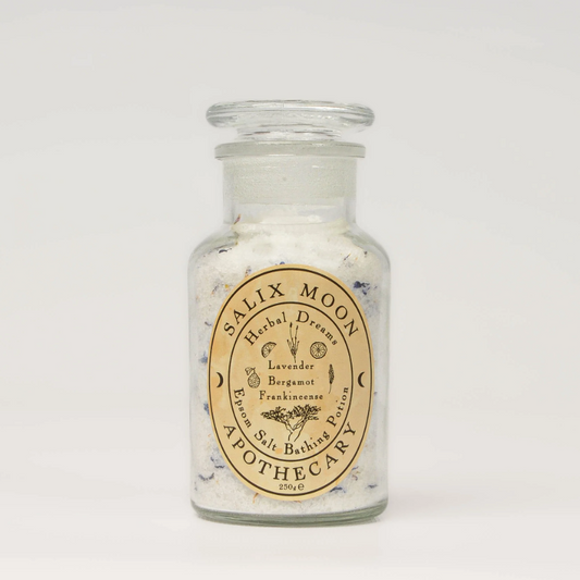Glass jar with Salix Moon Apothecary label on a white background