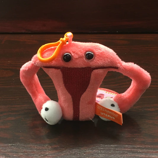 Pink and white plush in the shape of a uterus, with keyring attachment